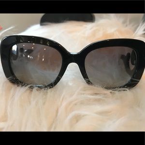 Authentic Women’s Prada sunglasses in black.